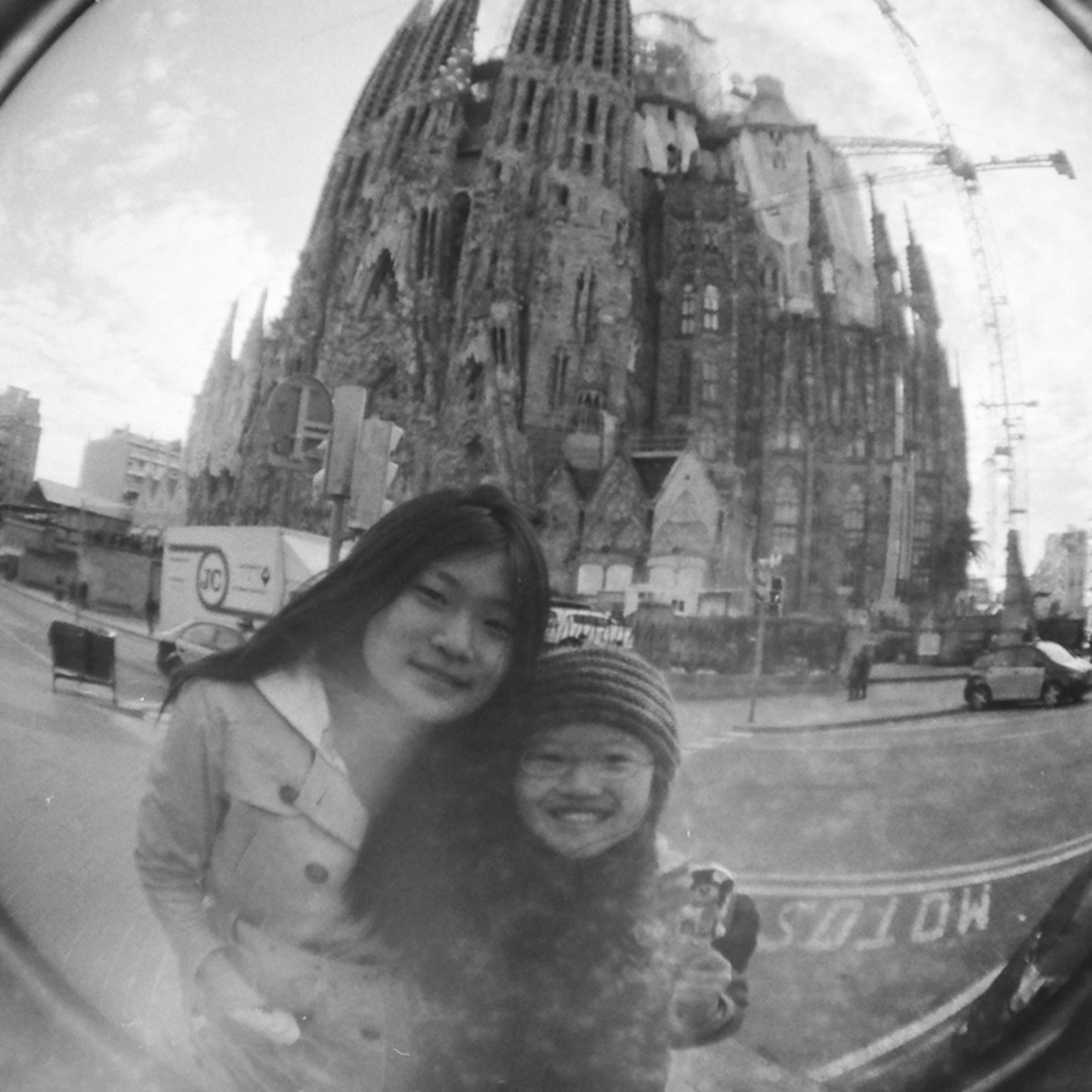 In front of the whimsical and ridiculously grand and out-of-proportions Sagrada Familia. Gaudi is amazing.